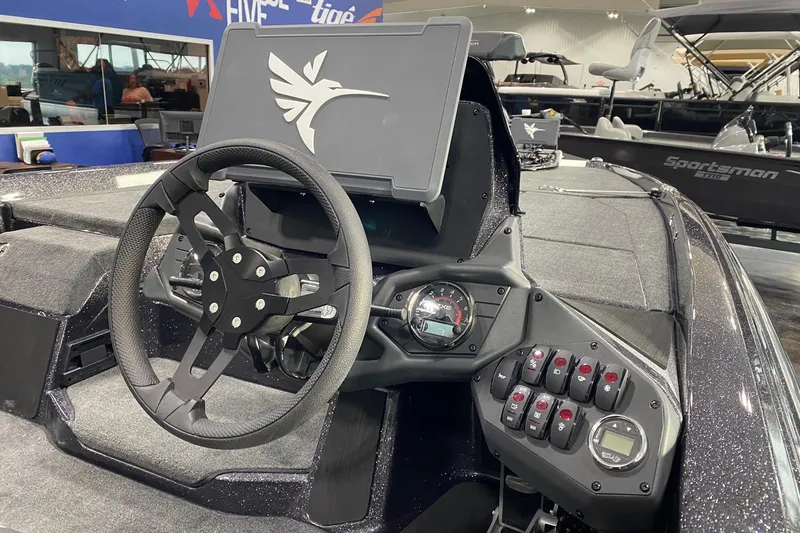 Slide: The Image of 2026 Skeeter ZXE21 boat dashboard with steering wheel and control panel. - 5