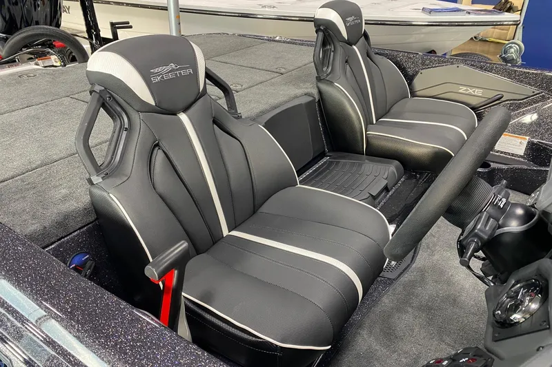 Slide: The Image of 2026 Skeeter ZXE21 boat interior with sleek black seats and modern design. - 6