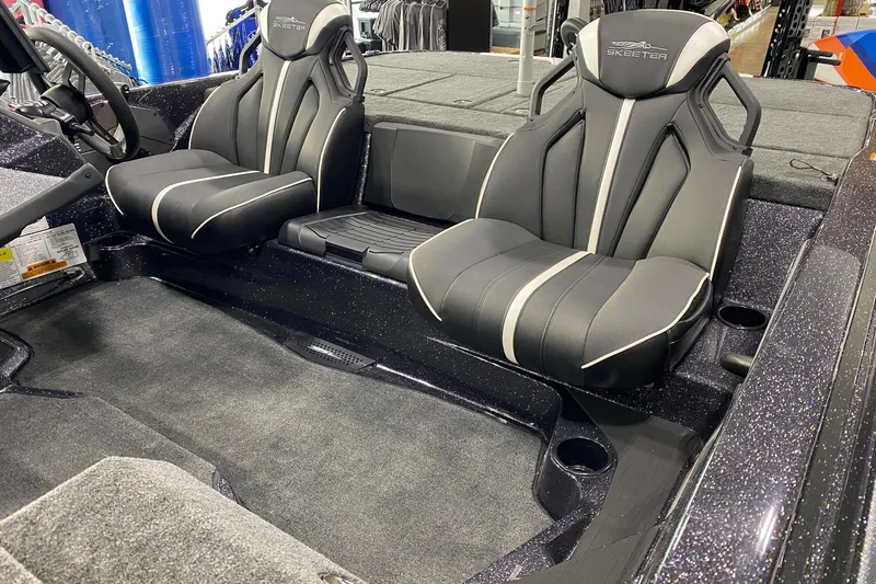 Slide: The Image of 2026 Skeeter ZXE21 boat interior with sleek black seats and modern design. - 8