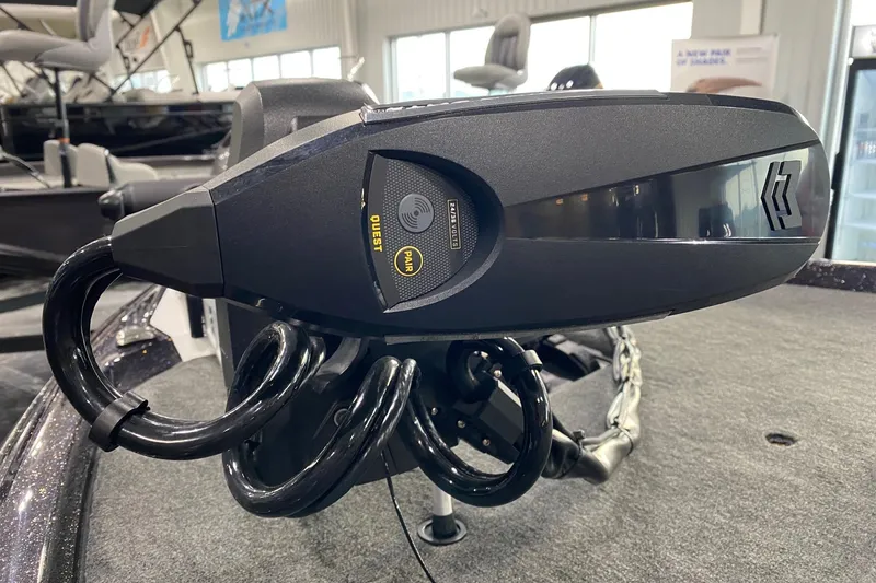 Slide: The Image of Close-up of 2026 Skeeter ZXE21 boat motor with control panel in showroom. - 9