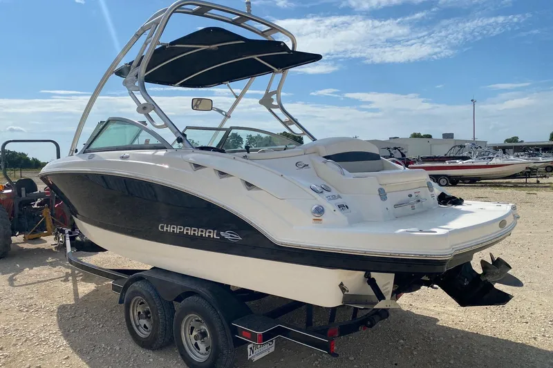 Slide: The Image of 2008 Chaparral Sunesta 224 boat on trailer under clear blue sky. - 3