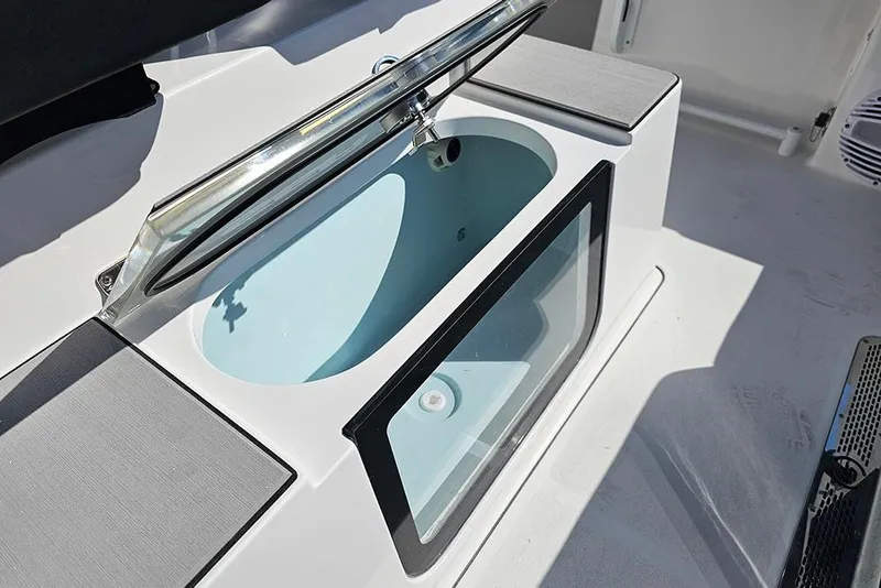Slide: The Image of 2026 Sea Pro 245 Sandbar boat livewell with open lid and sleek design. - 15