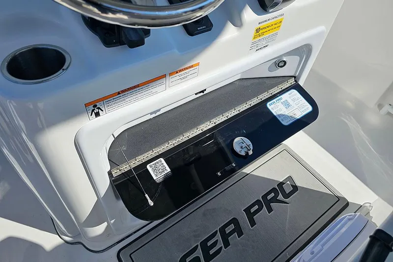 Slide: The Image of 2026 Sea Pro 245 Sandbar boat dashboard with steering wheel and control panel. - 18