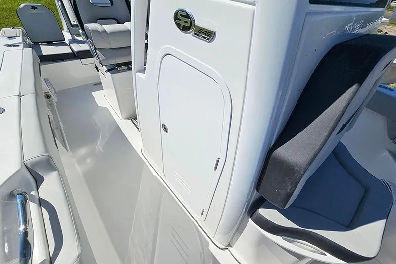 Slide: The Image of 2026 Sea Pro 245 Sandbar boat interior with seating and storage compartment. - 20