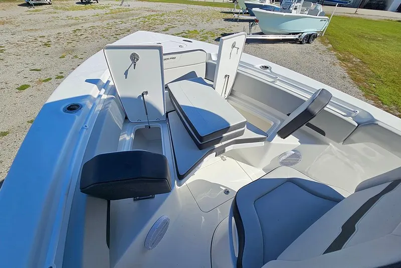 Slide: The Image of 2026 Sea Pro 245 Sandbar boat interior with seating and storage compartments. - 24