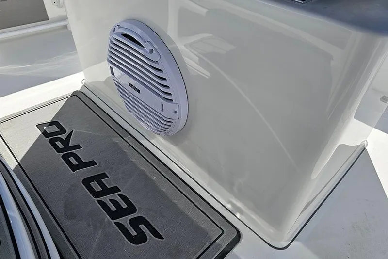 Slide: The Image of 2026 Sea Pro 245 Sandbar boat interior with speaker and branded mat. - 27