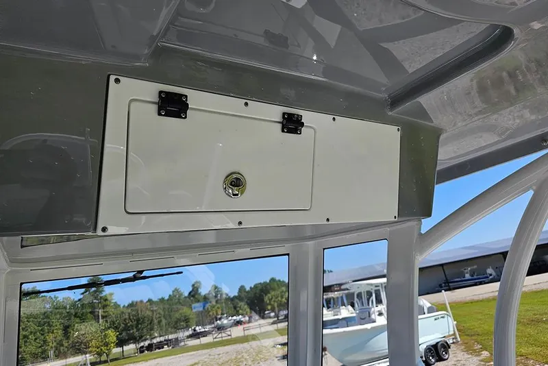 Slide: The Image of Interior view of 2026 Sea Pro 245 Sandbar boat with storage compartment. - 28