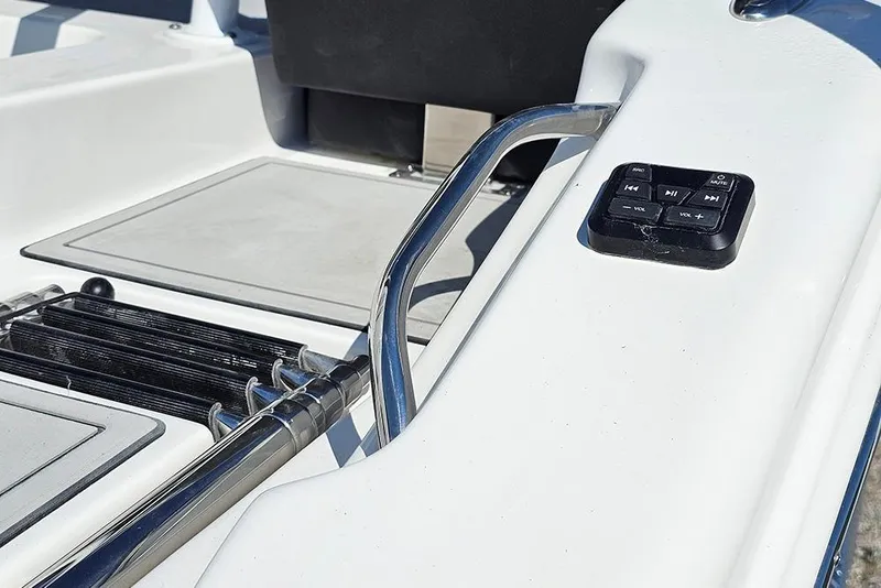 Slide: The Image of 2026 Sea Pro 245 Sandbar boat deck with control panel and stainless steel railing. - 34