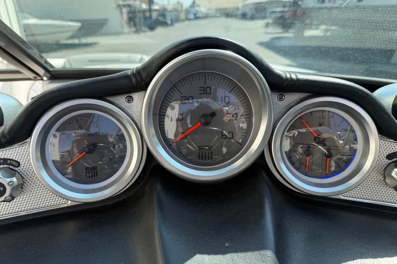 Slide: The Image of Dashboard of a 2015 MasterCraft X30 boat with speedometer and gauges. - 10