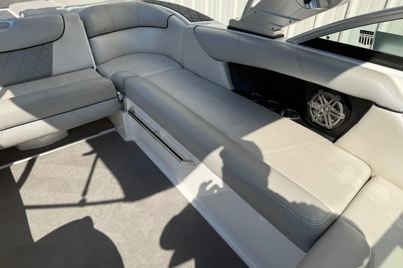 Slide: The Image of 2015 MasterCraft X30 interior with gray seating and built-in speaker. - 11