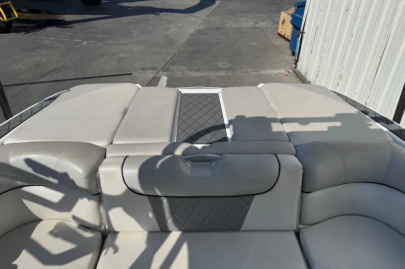 Slide: The Image of 2015 MasterCraft X30 boat interior with gray upholstery and diamond-patterned accents. - 14