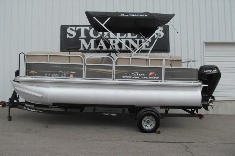 The Image of 2023 Sun Tracker Party Barge 18 DLX pontoon boat on trailer at dealership. - 1