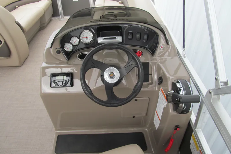 Slide: The Image of 2023 Sun Tracker Party Barge 18 DLX helm with steering wheel and control panel. - 6