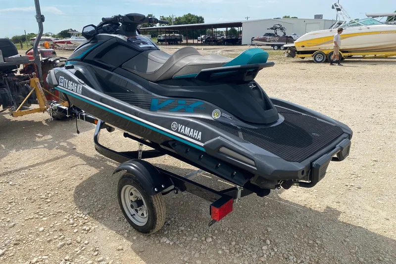 Slide: The Image of 2023 Yamaha WaveRunner VX Cruiser on trailer, parked outdoors. - 3