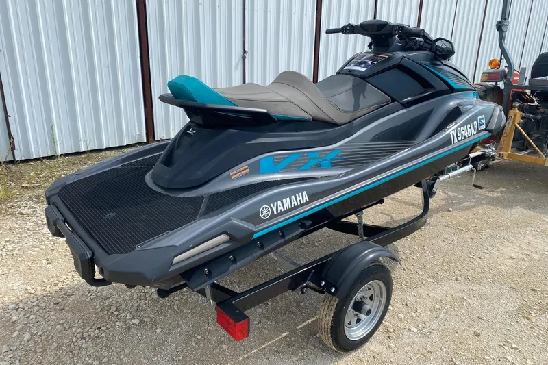 Slide: The Image of 2023 Yamaha WaveRunner VX Cruiser on trailer, parked outdoors. - 5