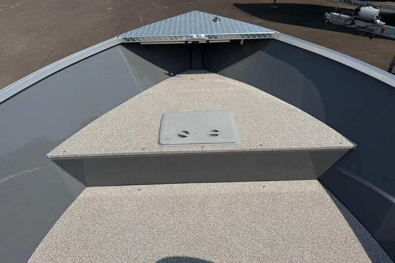 Slide: The Image of Open storage compartment on 2026 Fish Rite Angler 18 boat deck. - 4