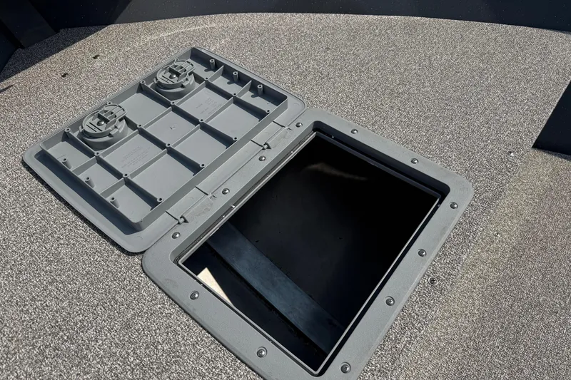 Slide: The Image of 2026 Fish Rite Angler 18 boat interior with motor, featuring spacious deck and seating. - 5