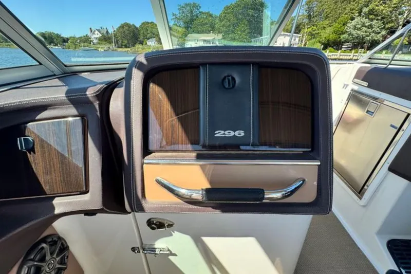 Slide: The Image of Interior of 2012 Cobalt 296 boat, featuring dashboard and control panel. - 18