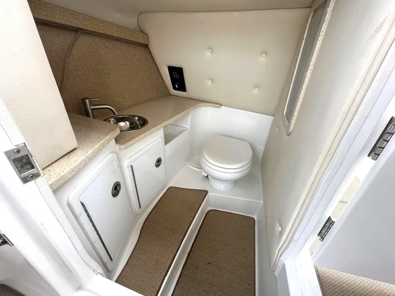Slide: The Image of 2012 Cobalt 296 boat interior bathroom with sink and toilet. - 20