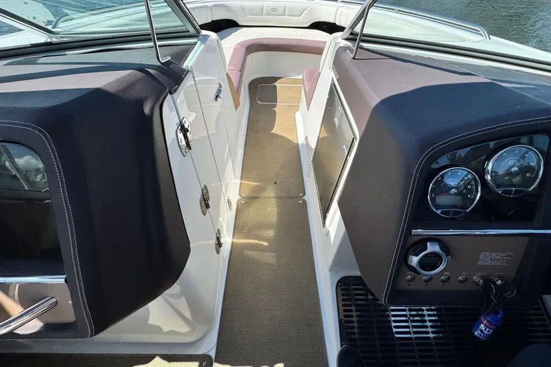 Slide: The Image of Interior view of a 2012 Cobalt 296 boat cockpit with dashboard and seating. - 23