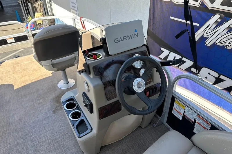 Slide: The Image of 2022 Sun Tracker Bass Buggy 18 DLX boat console with Garmin navigation system. - 17
