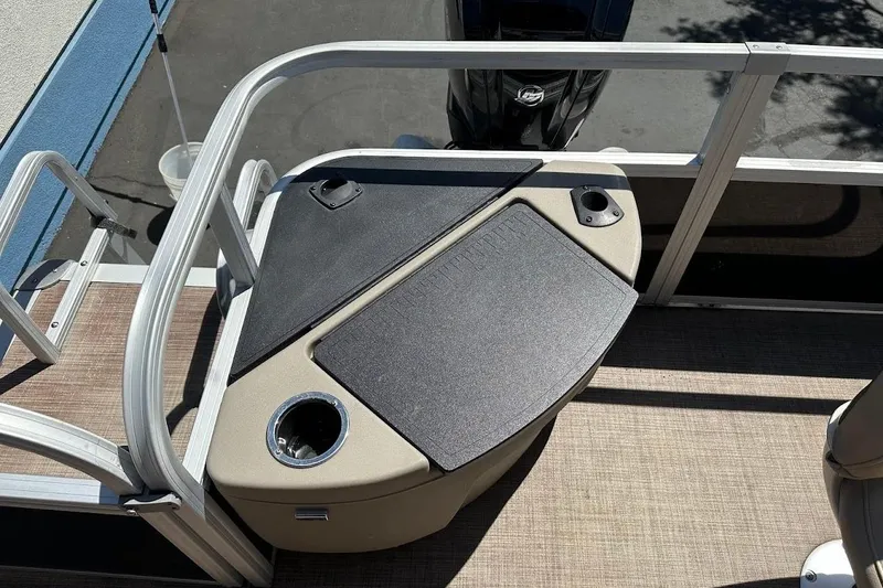Slide: The Image of 2022 Sun Tracker Bass Buggy 18 DLX boat deck with seating and cup holders. - 24