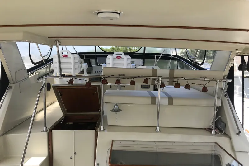 Slide: The Image of 1988 Tollycraft 40 Sundeck Motor Yacht interior with seating and helm station. - 11