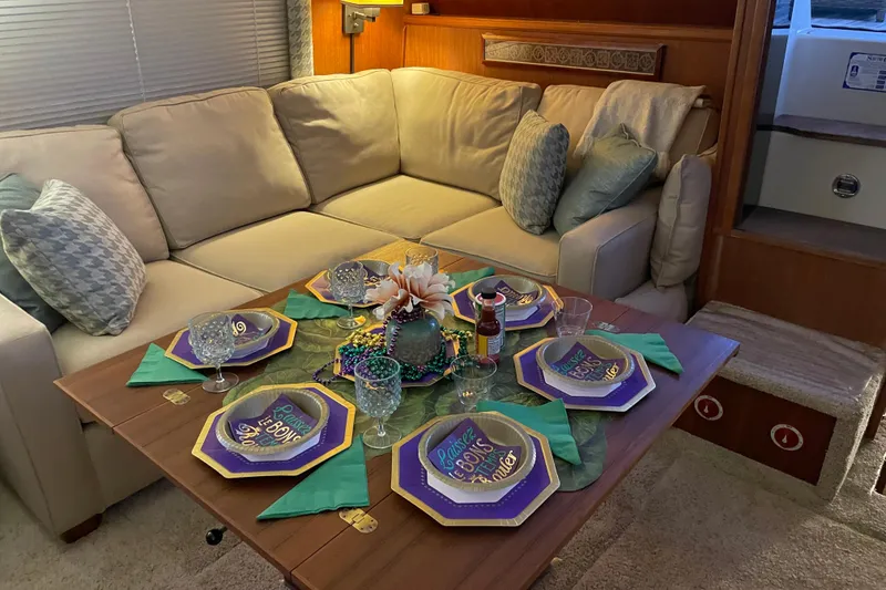 Slide: The Image of Cozy dining setup on 1988 Tollycraft 40 Sundeck Motor Yacht with festive tableware. - 20
