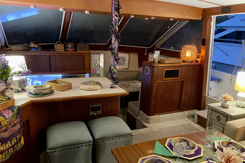Slide: The Image of 1988 Tollycraft 40 Sundeck Motor Yacht interior with festive Mardi Gras decor. - 22