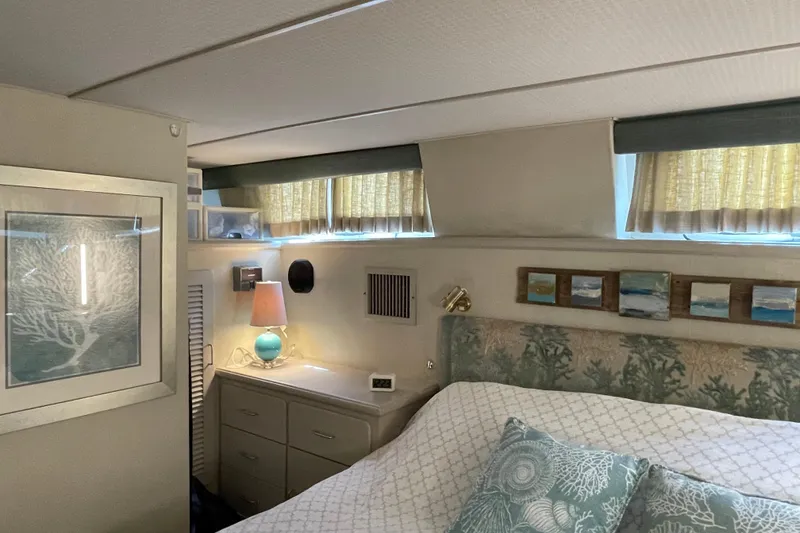 Slide: The Image of Cozy bedroom interior of 1988 Tollycraft 40 Sundeck Motor Yacht with nautical decor. - 33