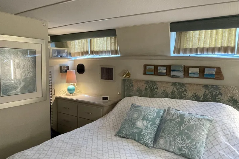 Slide: The Image of Cozy bedroom interior of 1988 Tollycraft 40 Sundeck Motor Yacht with nautical decor. - 34