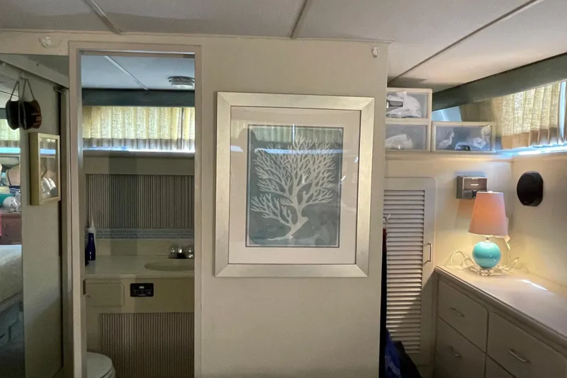 Slide: The Image of Interior of 1988 Tollycraft 40 Sundeck Motor Yacht with framed artwork and lamp. - 37