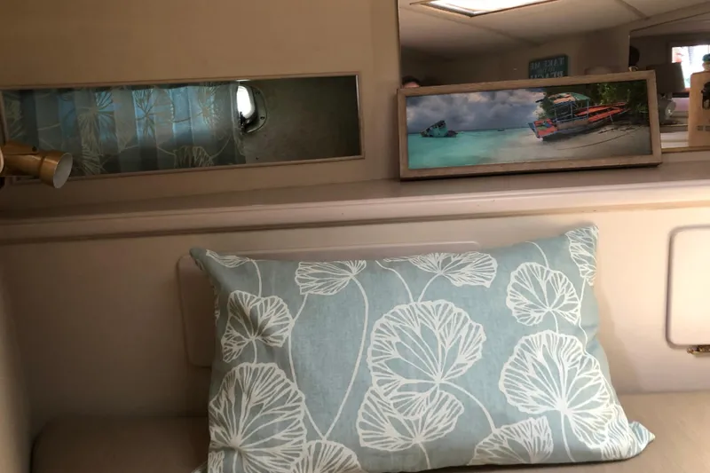Slide: The Image of Interior of 1988 Tollycraft 40 Sundeck Motor Yacht with decorative pillow and framed artwork. - 38