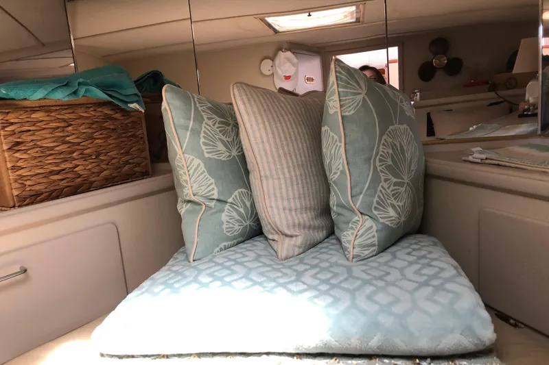 Slide: The Image of Cozy interior of 1988 Tollycraft 40 Sundeck Motor Yacht with decorative pillows and wicker basket. - 39