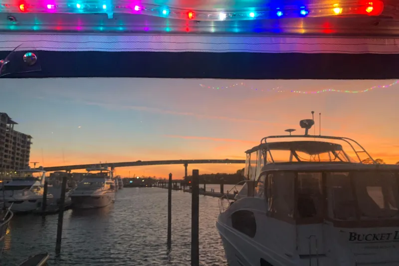 Slide: The Image of 1988 Tollycraft 40 Sundeck Motor Yacht at sunset with colorful lights. - 4