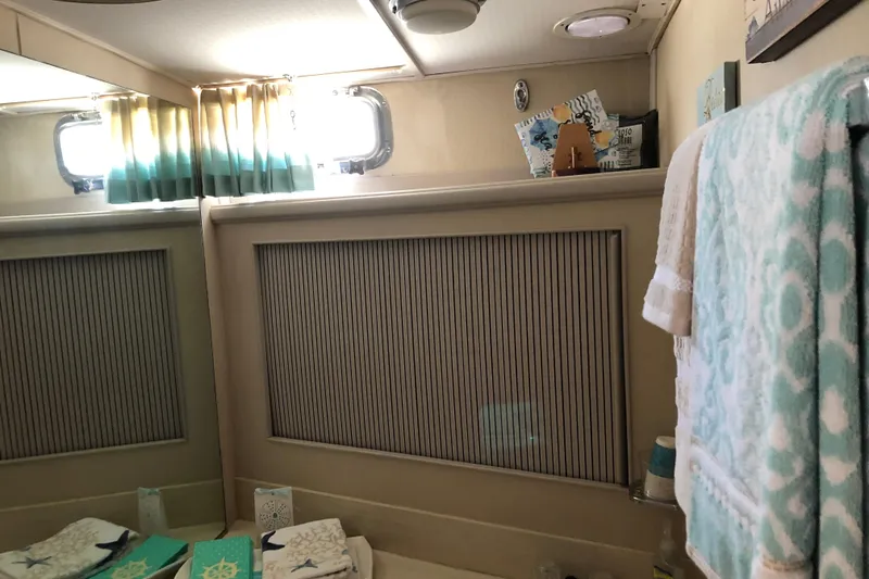 Slide: The Image of Bathroom interior of 1988 Tollycraft 40 Sundeck Motor Yacht with nautical decor. - 40