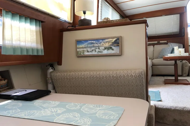 Slide: The Image of Interior of 1988 Tollycraft 40 Sundeck Motor Yacht with cozy seating and decor. - 42