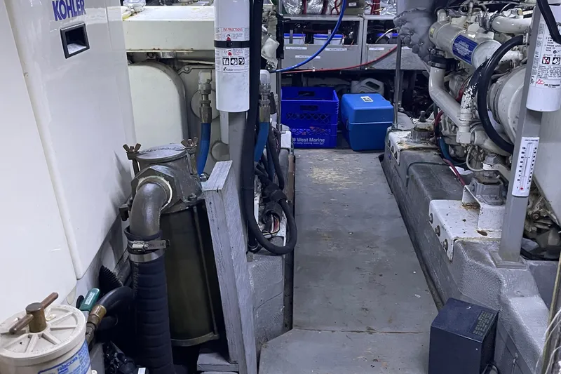 Slide: The Image of Engine room of 1988 Tollycraft 40 Sundeck Motor Yacht with visible machinery and equipment. - 44