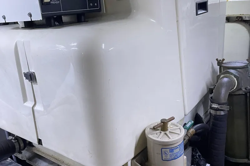 Slide: The Image of Engine room of 1988 Tollycraft 40 Sundeck Motor Yacht with visible machinery components. - 45