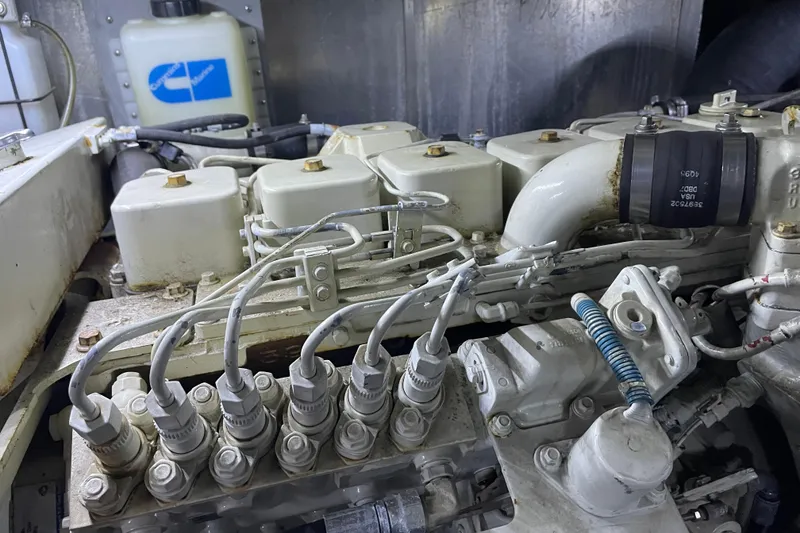 Slide: The Image of Engine components of a 1988 Tollycraft 40 Sundeck Motor Yacht, showcasing intricate mechanical details. - 47