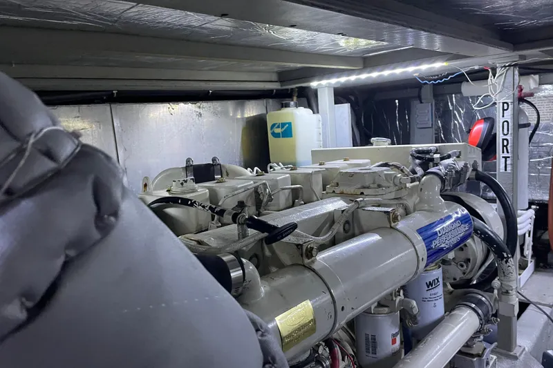 Slide: The Image of Engine room of 1988 Tollycraft 40 Sundeck Motor Yacht, featuring mechanical components. - 51