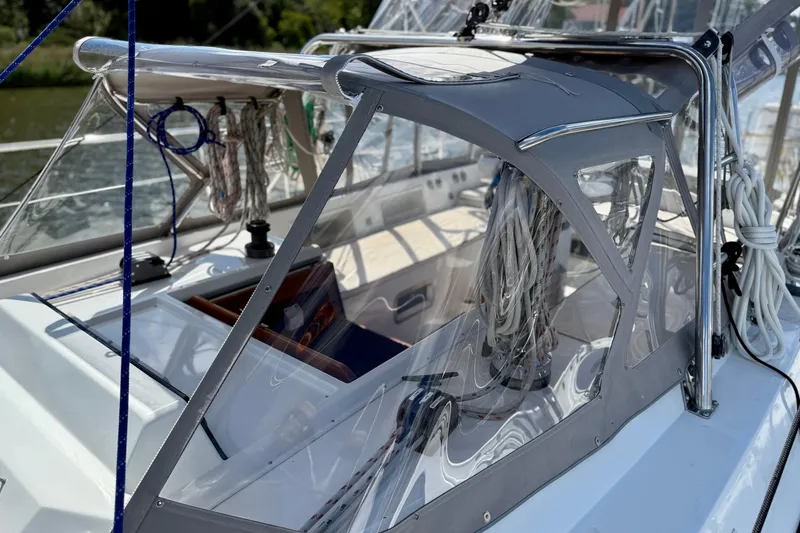 Slide: The Image of 1984 Tayana 55 sailboat cockpit with ropes and clear canopy. - 14