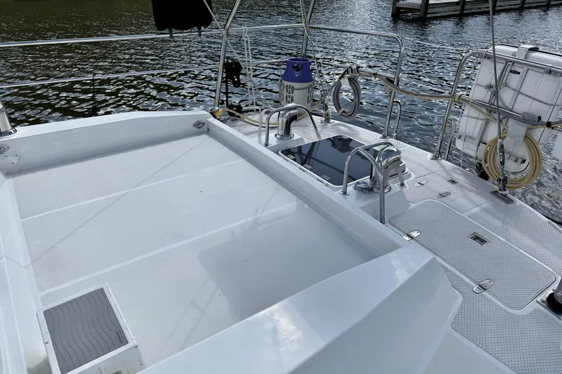 Slide: The Image of Deck view of 1984 Tayana 55 sailboat, featuring clean lines and nautical equipment. - 20