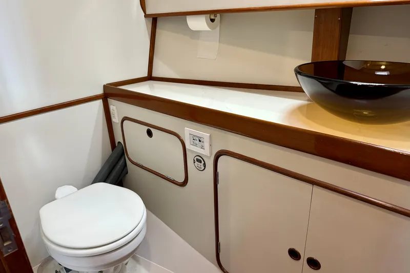 Slide: The Image of Bathroom interior of 1984 Tayana 55 yacht with modern sink and toilet. - 44