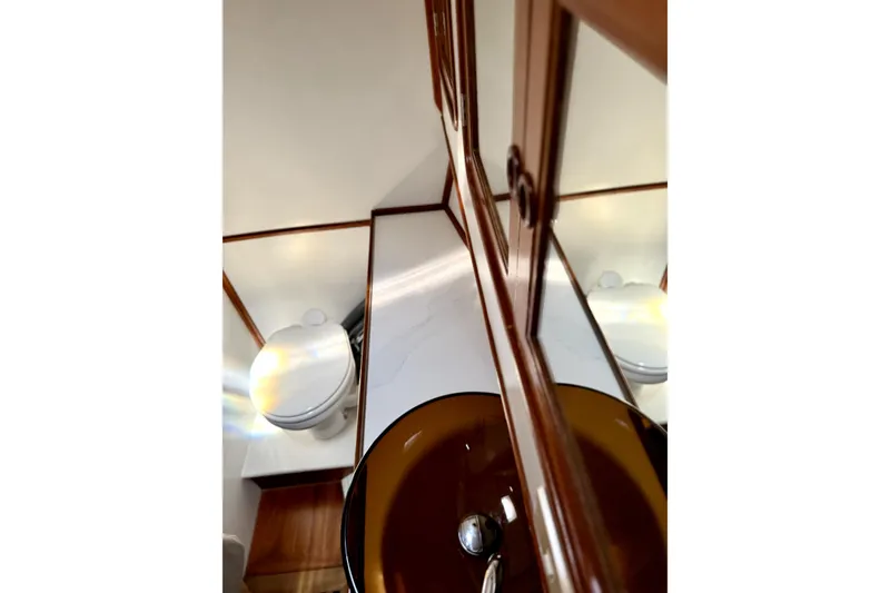 Slide: The Image of Bathroom interior of 1984 Tayana 55 yacht with wooden cabinetry and modern fixtures. - 48