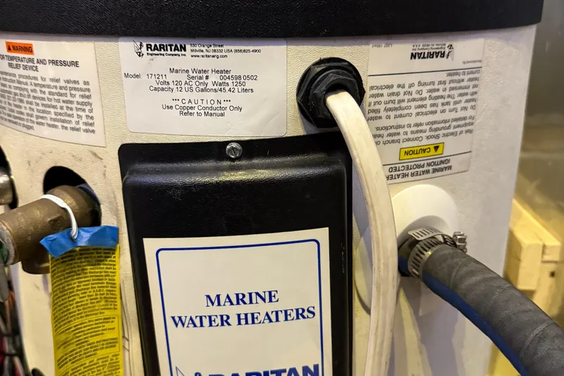 Slide: The Image of Marine water heater by Raritan, model 172211, on a 1984 Tayana 55 yacht. - 55