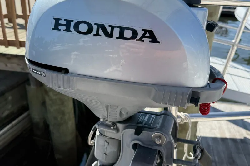 Slide: The Image of Honda outboard motor on a 1984 Tayana 55 sailboat, dockside view. - 61