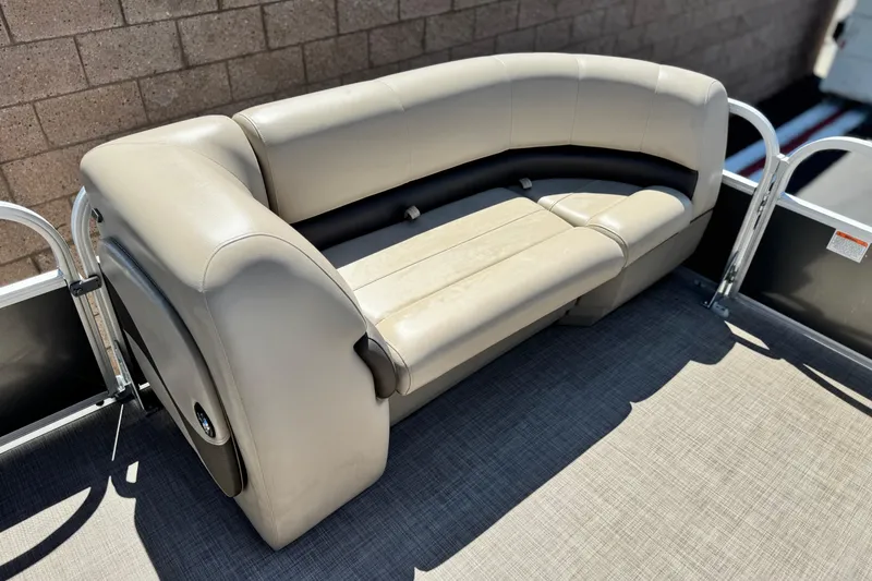 Slide: The Image of 2023 Sun Tracker Party Barge 18 DLX pontoon boat seating, beige upholstery, outdoor setting. - 10