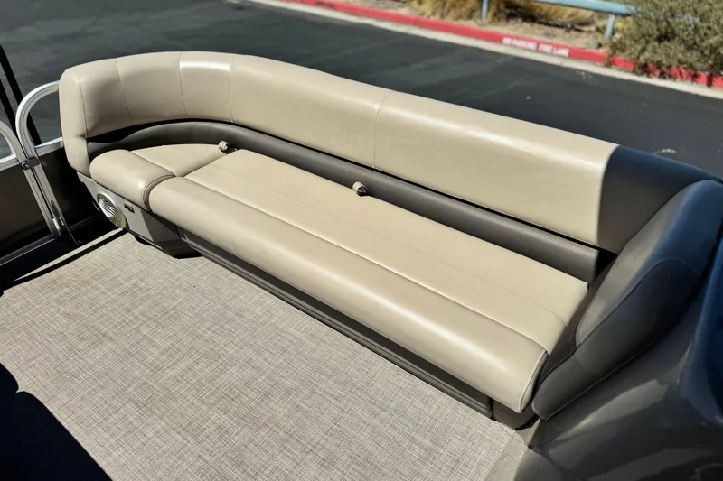 Slide: The Image of 2023 Sun Tracker Party Barge 18 DLX, beige seating, outdoor setting. - 12