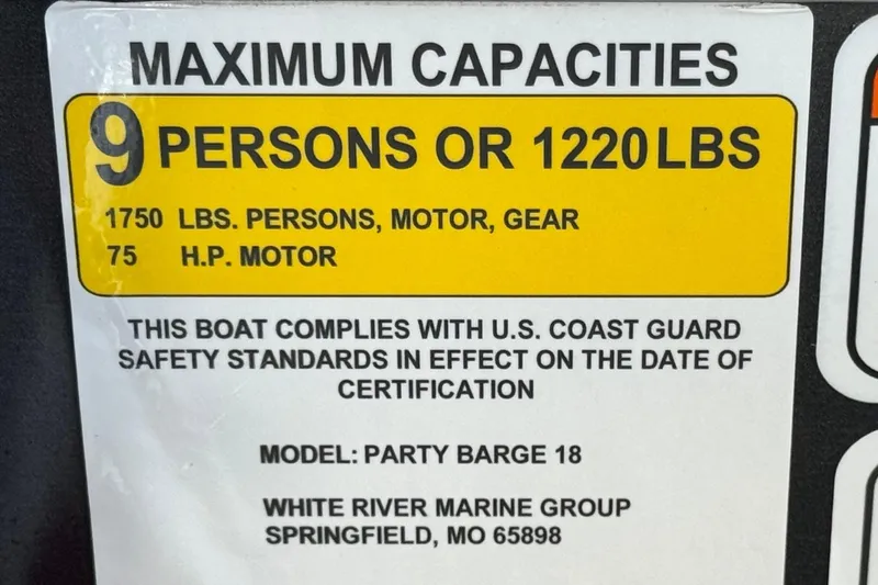 Slide: The Image of 2023 Sun Tracker Party Barge 18 DLX capacity label, 9 persons or 1220 lbs, U.S. Coast Guard compliant. - 25